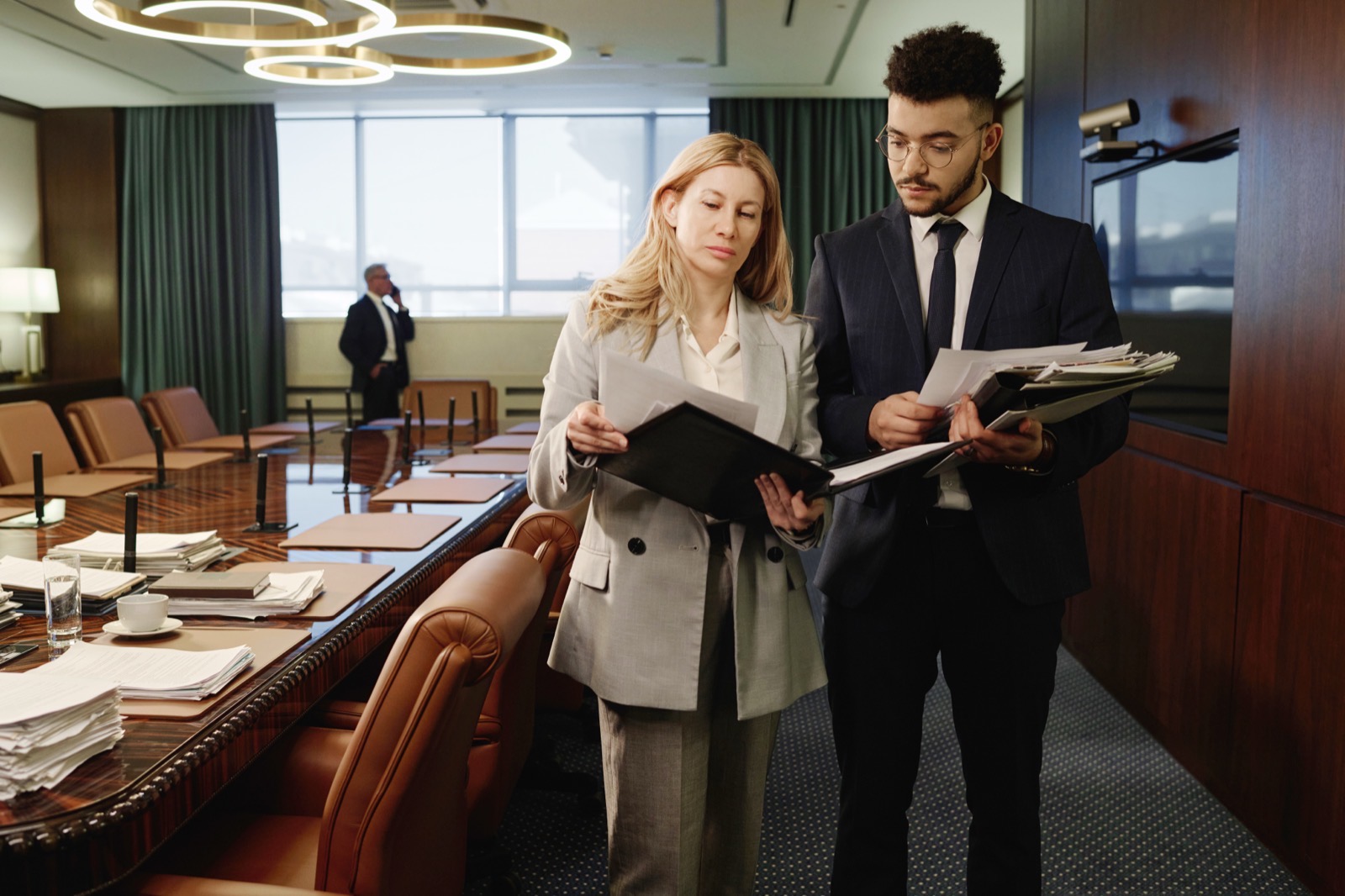 Biracial attorneys looking through documents in sp 2024 01 26 13 50 42 utc